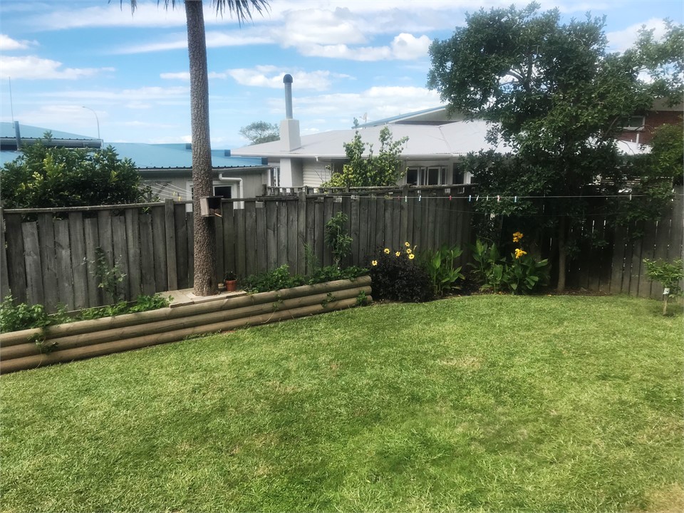 Vegetable garden front lawn with fenced section