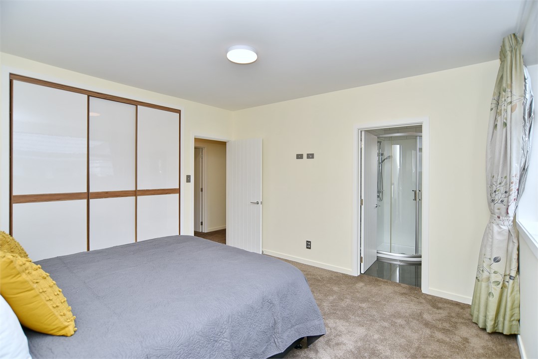 Bedroom 1 includes a luxury king-sized bed and a s