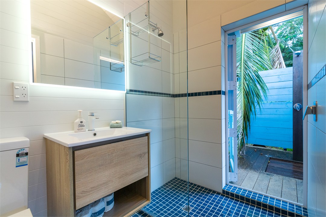 Ensuite bathroom opens onto outdoor shower