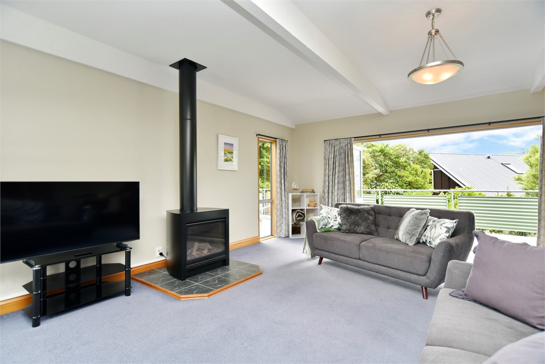 Living room has a TV and seating areas