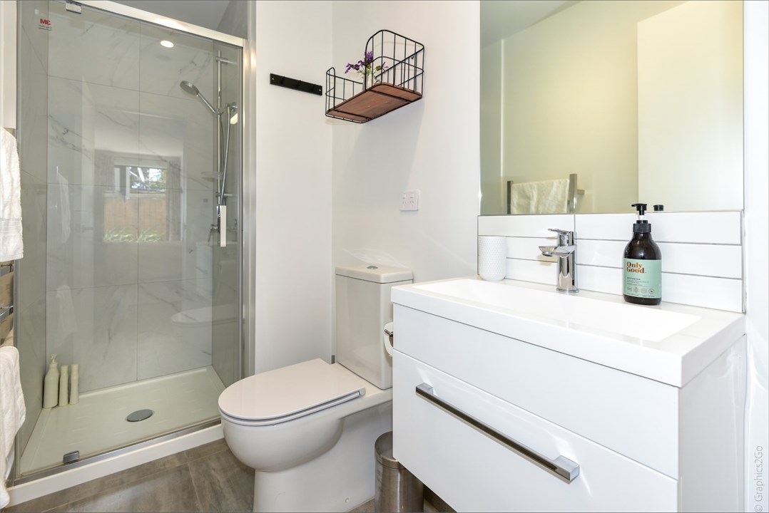 Bathroom 1 has a shower and a toilet