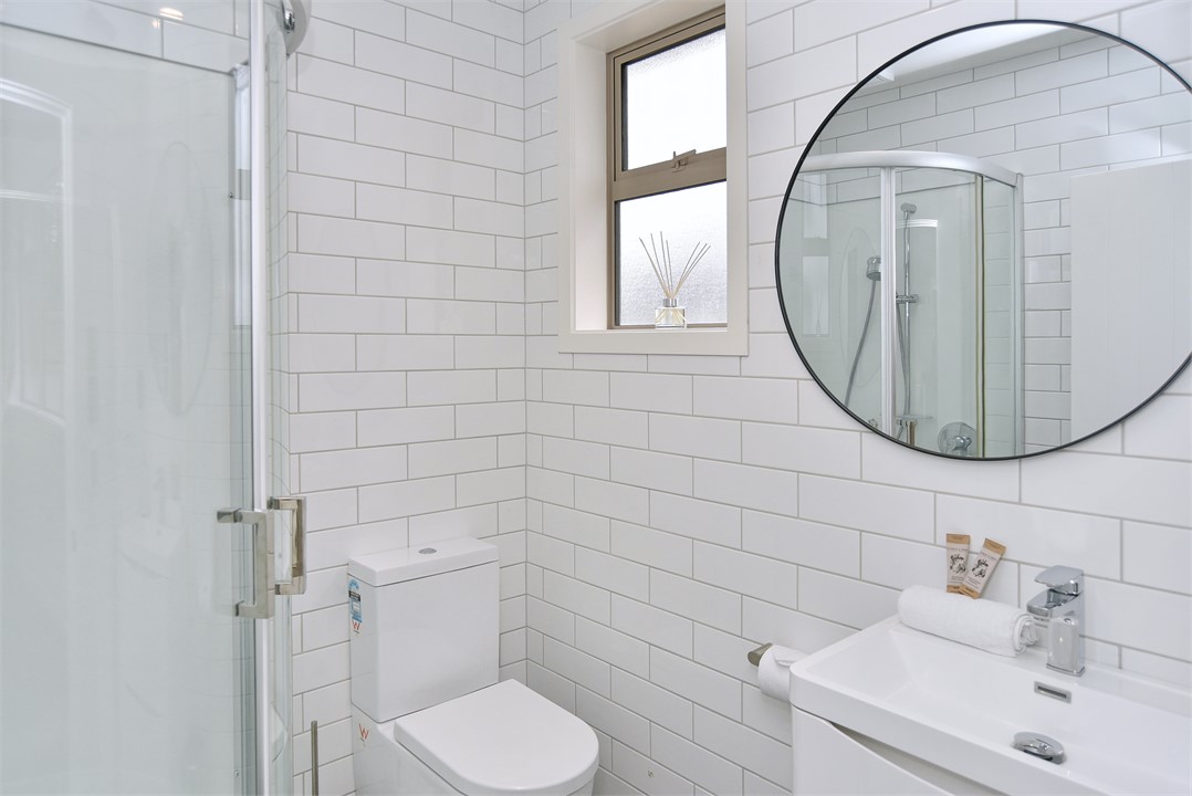 Bedroom 1's ensuite includes a shower and toilet