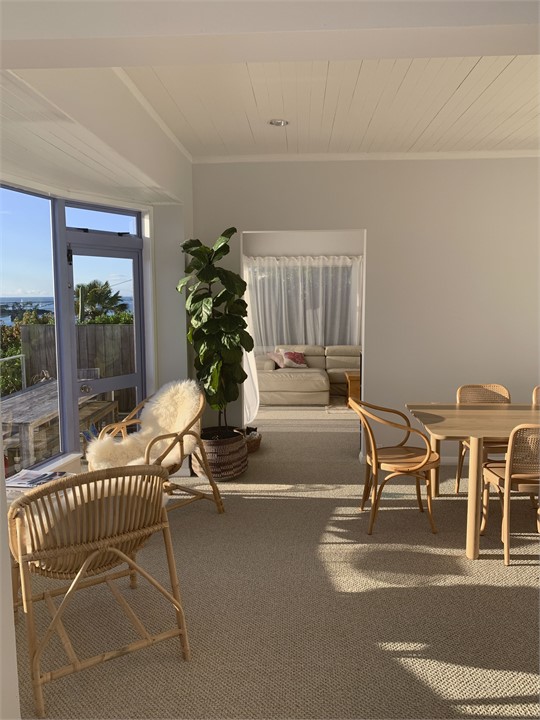 Looking through from kitchen to dining to living r