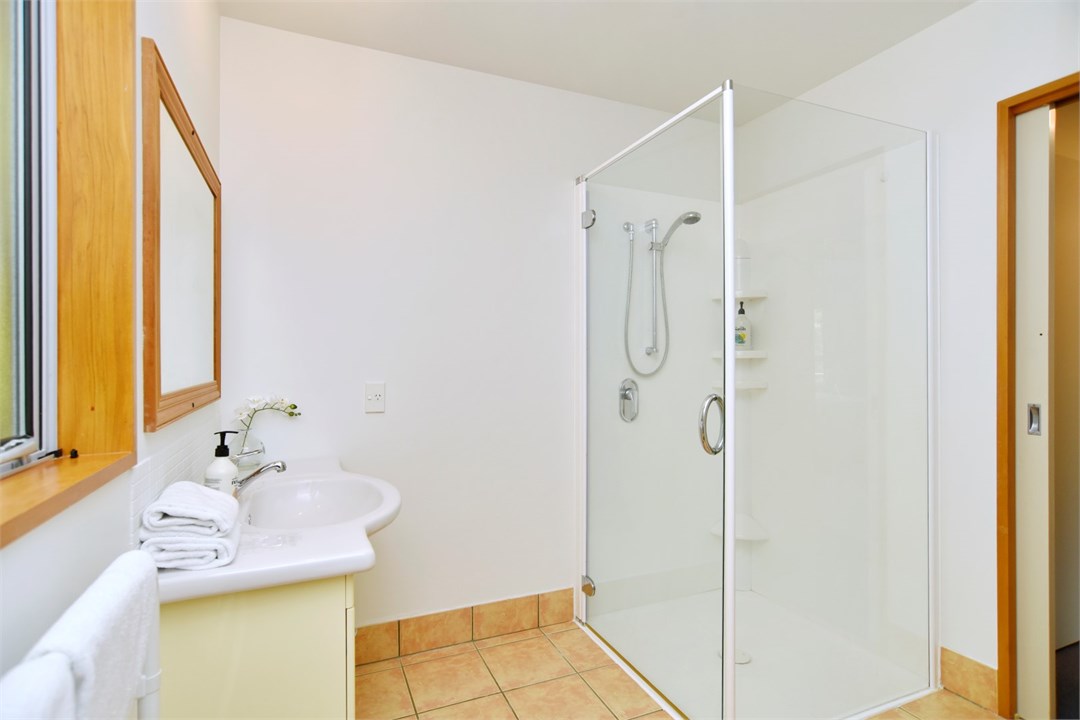 Bathroom 2 has a shower and a toilet