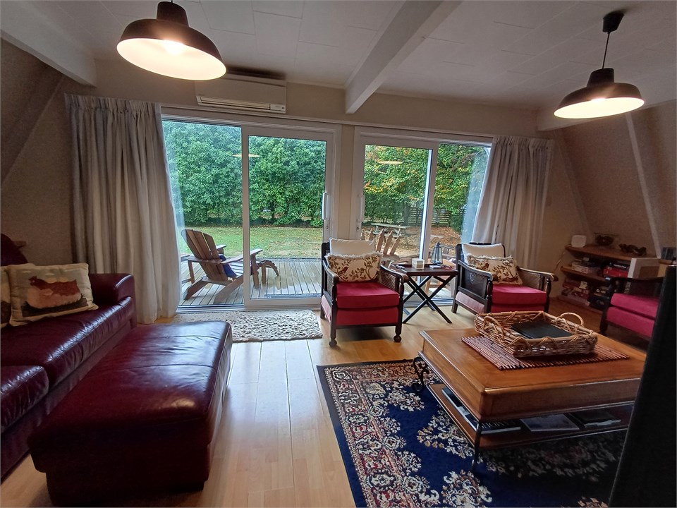 Living area with plenty of seating. Double sliding