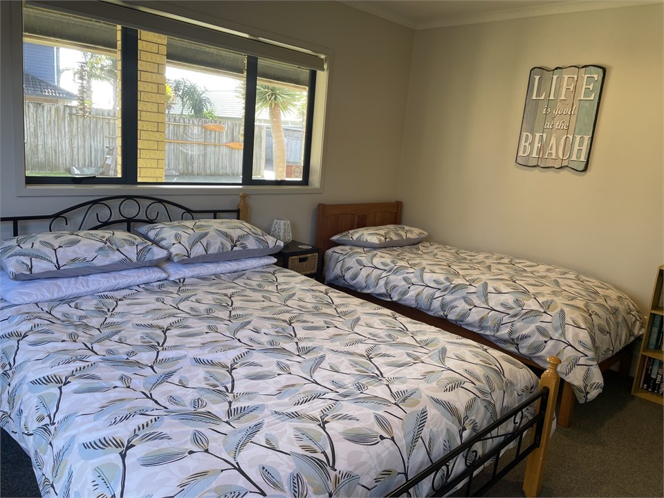 Downstairs bedroom, queen bed and single bed