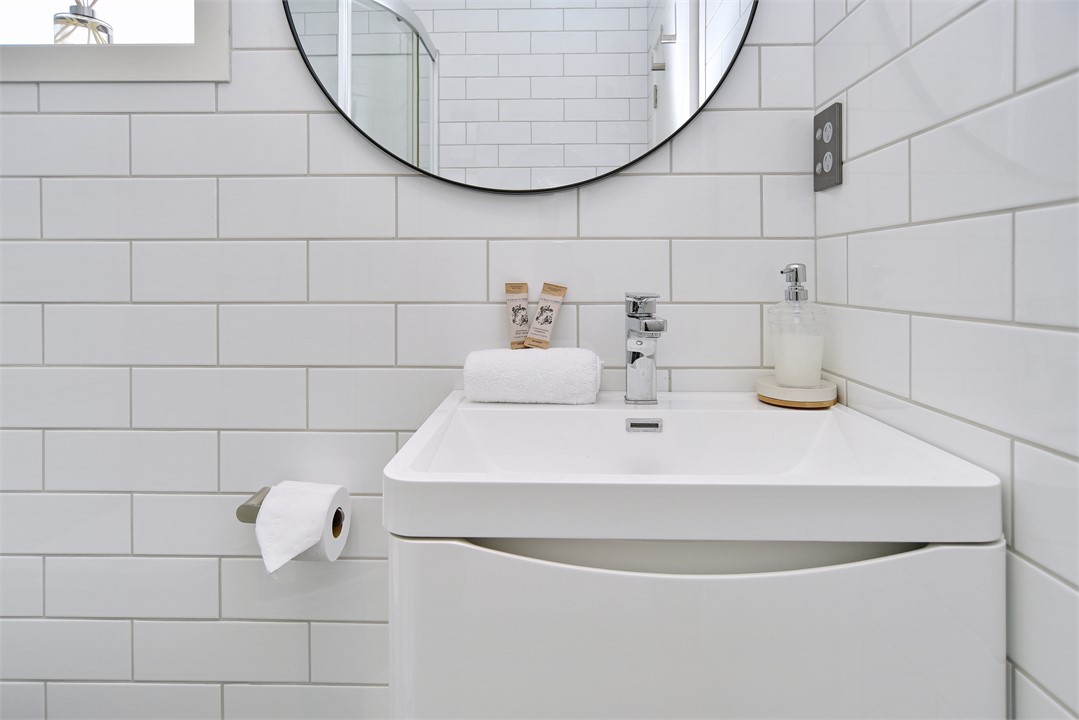 Bedroom 1's ensuite includes a shower and toilet