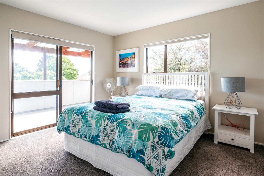 Upstairs bedroom with covered deck.