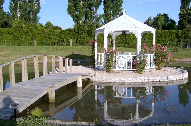 Bridge to Summerhouse Seating & Pond