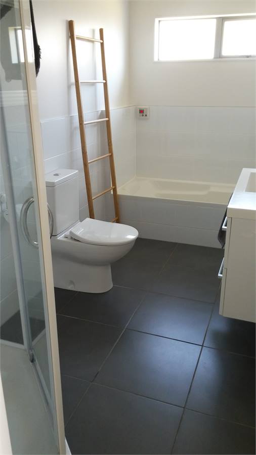 Two large bathrooms, one at each end of the house