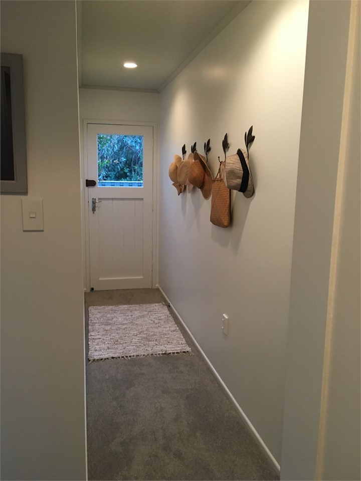 Hall leading to private back garden