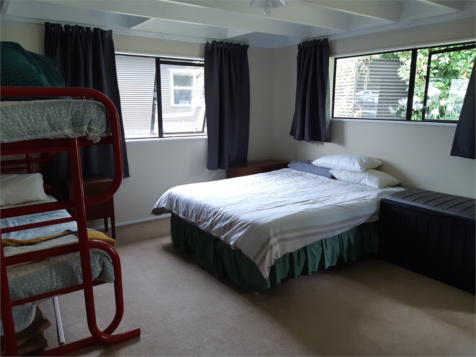 Bunkroom aso has a set of single bunks and a queen