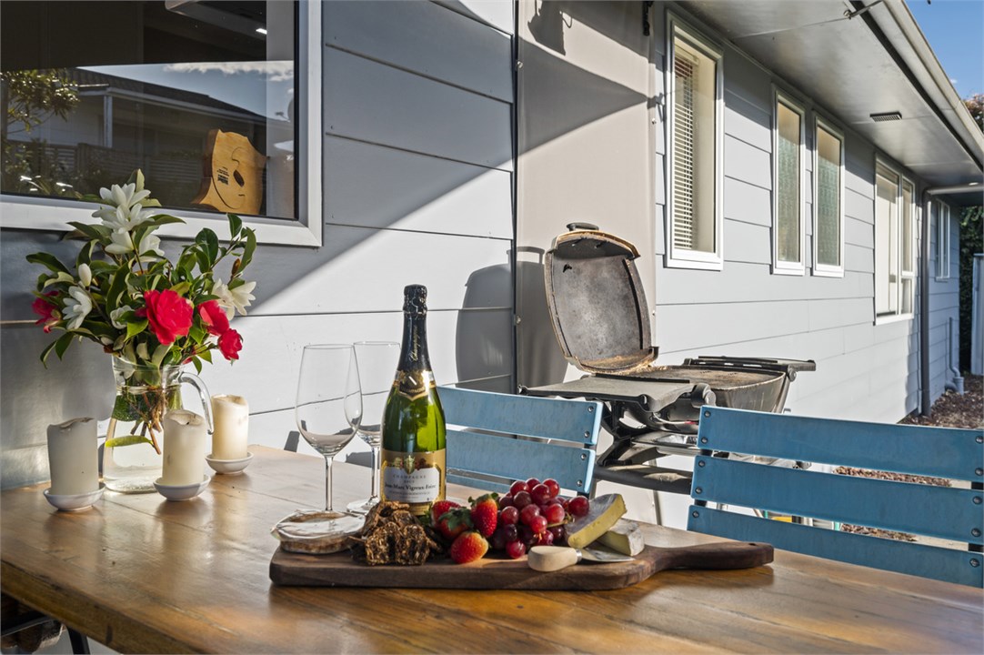 Private outdoor entertaining area with shade sail