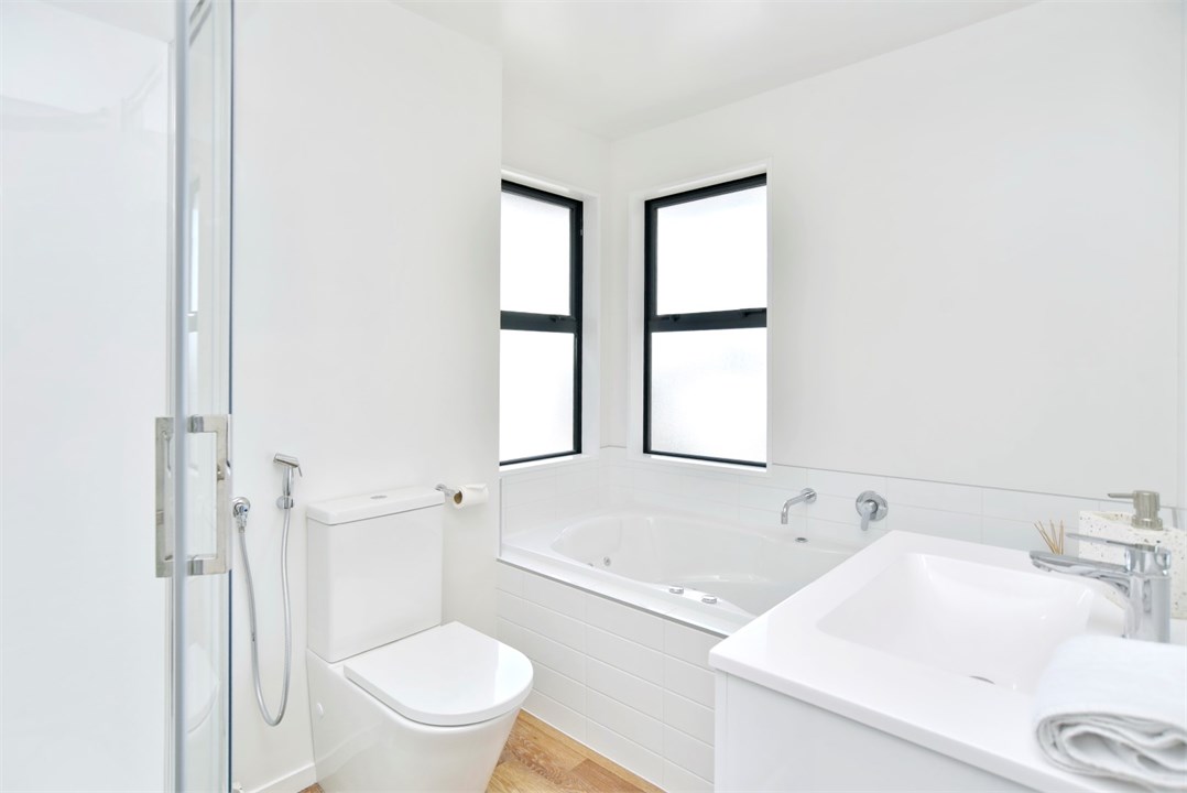 Main bathroom - has a spa bath, shower and toilet