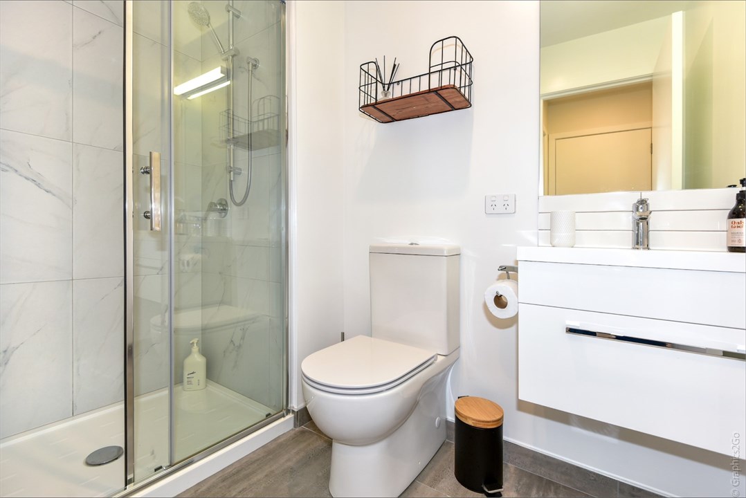 Bathroom 2 has a shower and a toilet