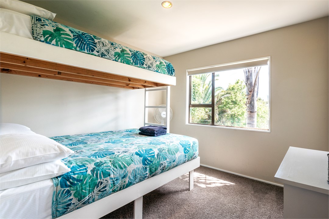 Upstairs bedroom with king single bunk over queen.