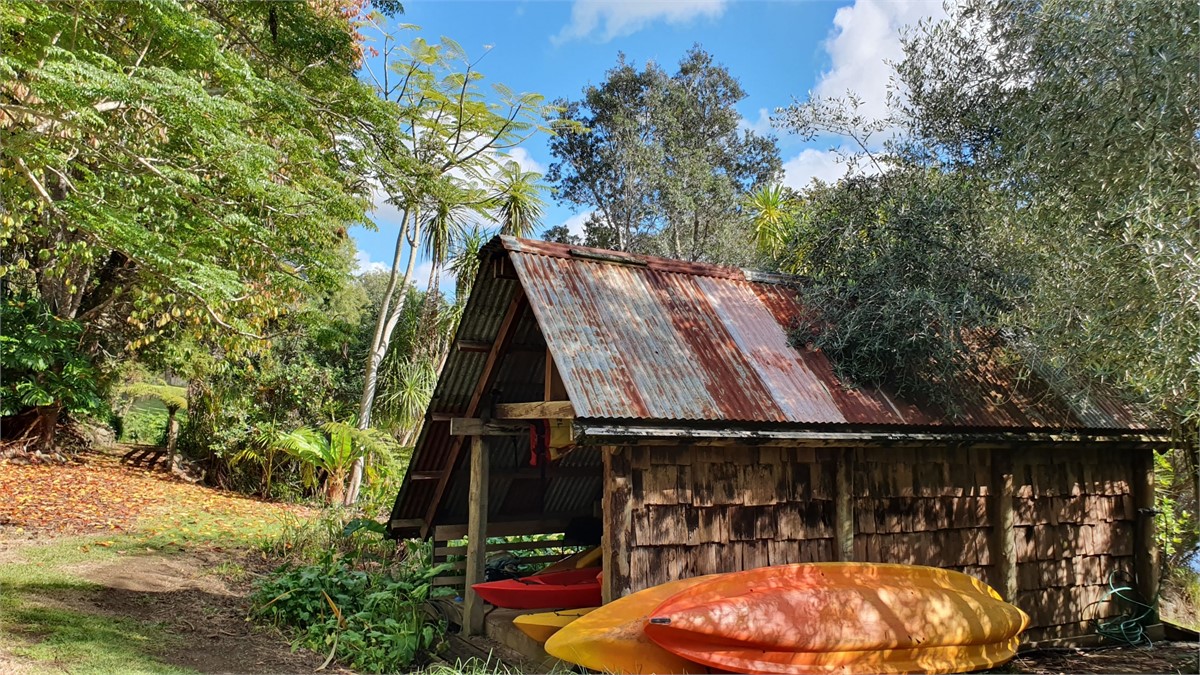 Private boathouse with kayaks and canoes