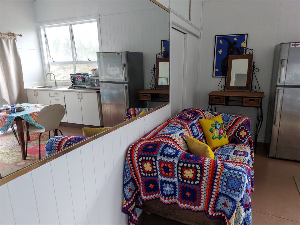 LIVING ROOM REFLECTED IN MIRROR