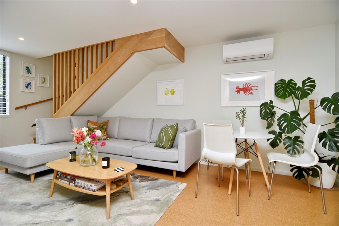 Living room with seating areas and a TV