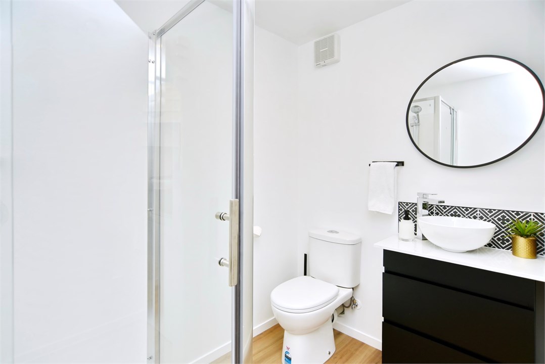 Bathroom 2 has a shower and a toilet