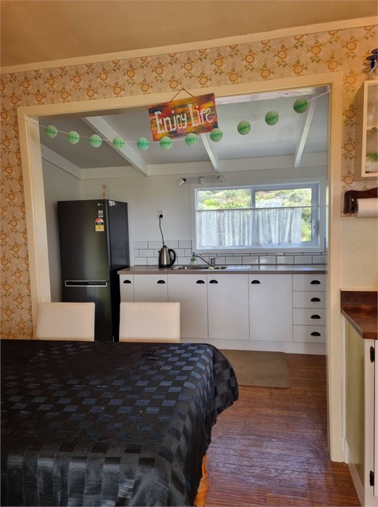 Looking from Living through dining room into kitch