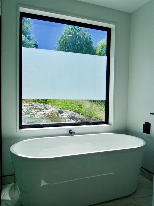 Soak in the bath after a day out in Queenstown