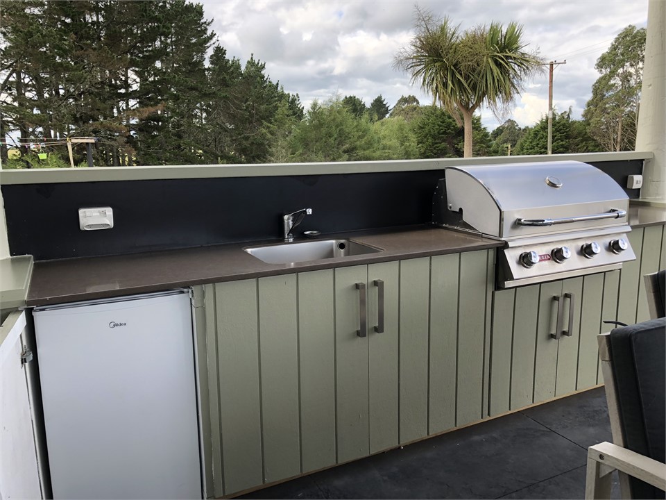 Inbuilt 'Bull" stainless barbecue and bar fridge