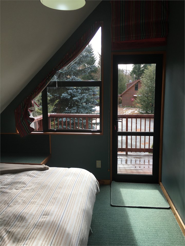 1st guest queen bedroom with balcony