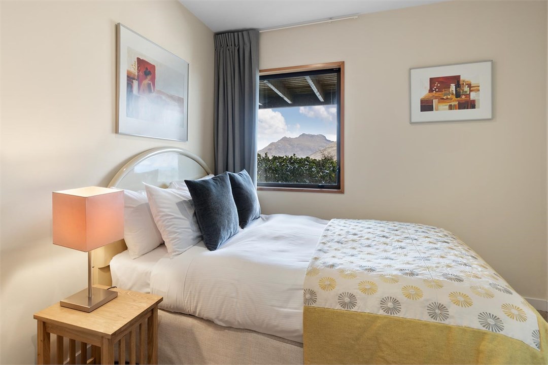 Bedroom 3 with double bed and views of Cecil Peak