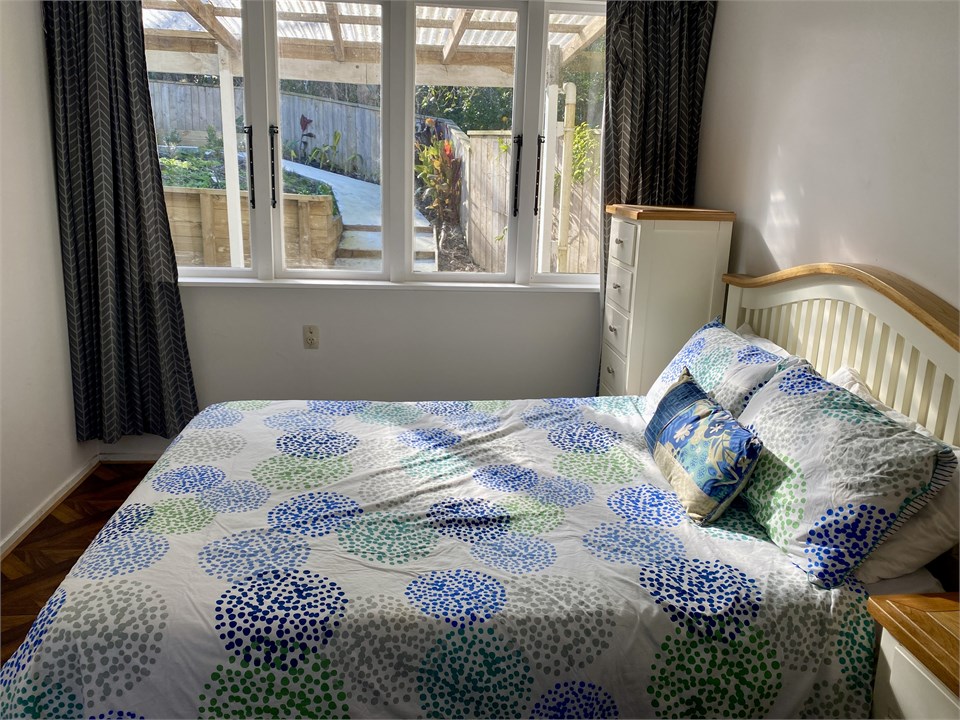 Downstairs bedroom with garden views