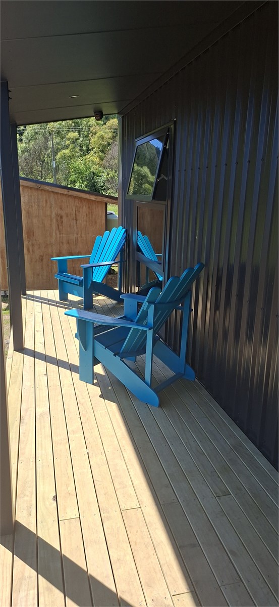 Cape cod seating area on veranda with ocean views