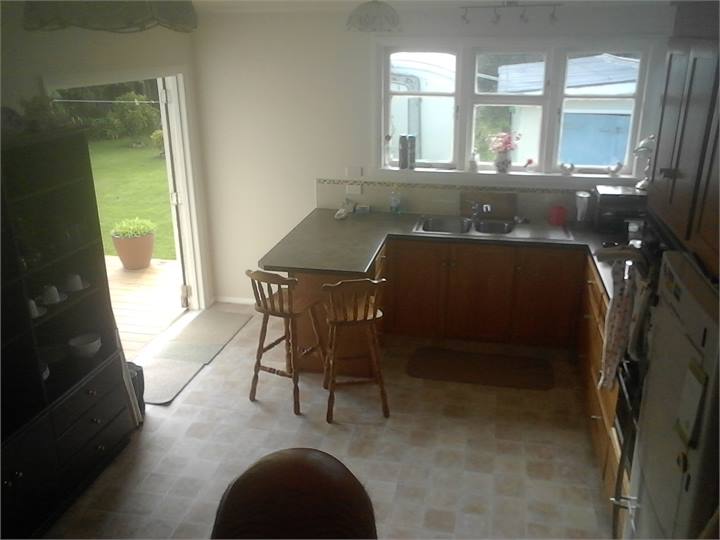 looking from kitchen to french door to deck