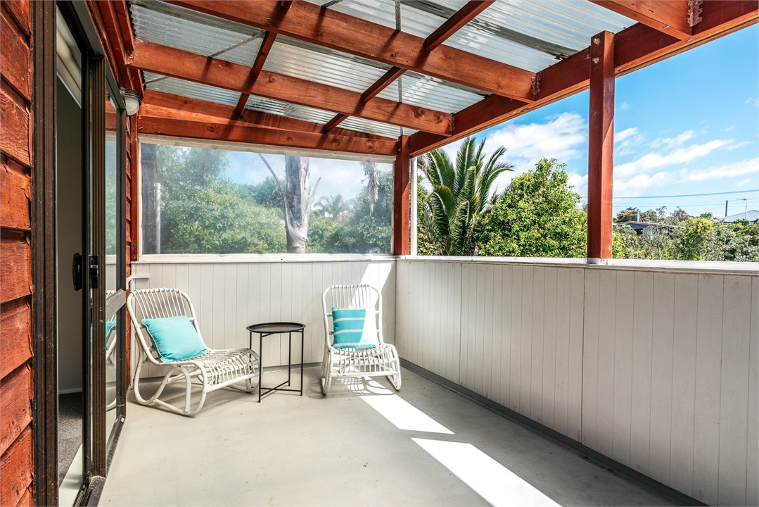 Covered deck off upstairs bedroom.