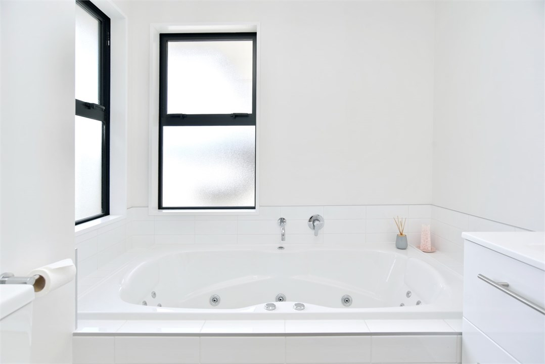 Main bathroom - has a spa bath, shower and toilet