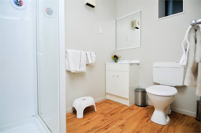 Downstairs Bathroom with Shower, Toilet & Vanity.