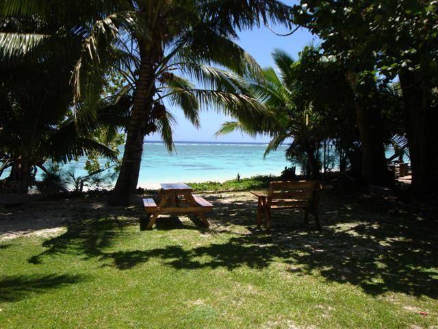 Lovely green lawn runs from house to beach