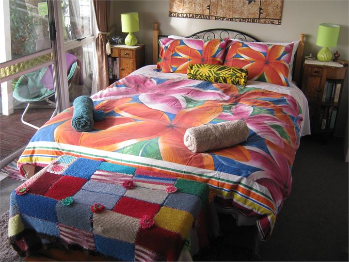 The Queen size bed and blanket box.