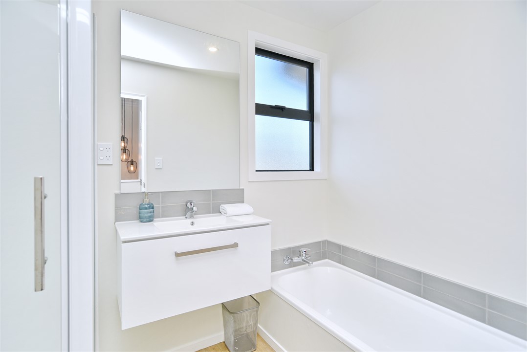 Bathroom 1 has a Shower and a bathtub