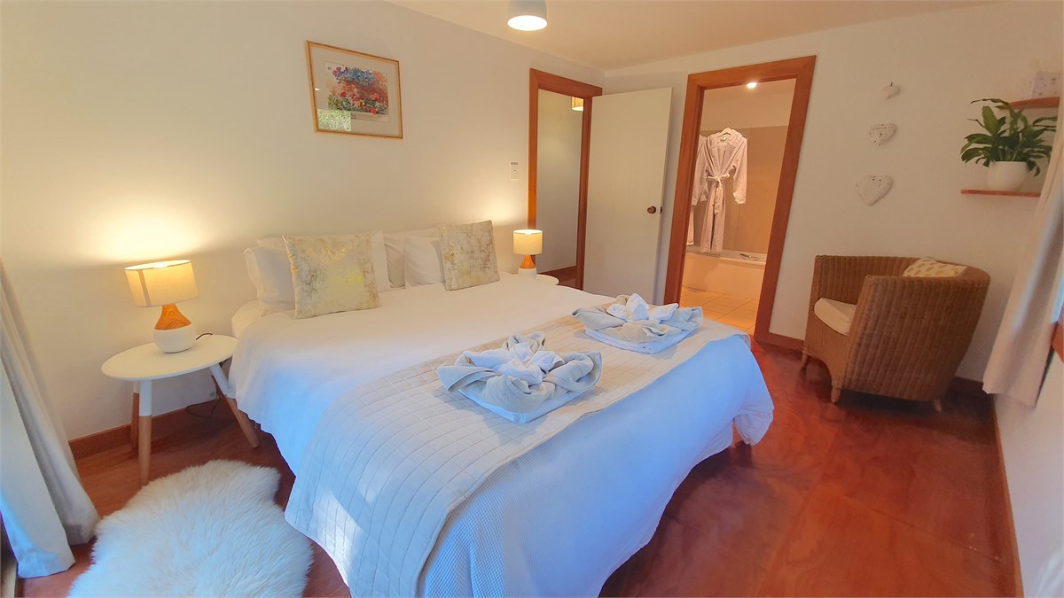 Master bedroom with king bed and en suite bathroom