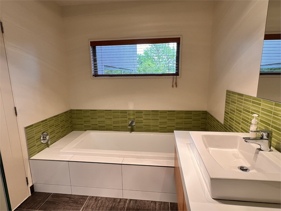 Bathroom 1 has a shower, bath and a toilet