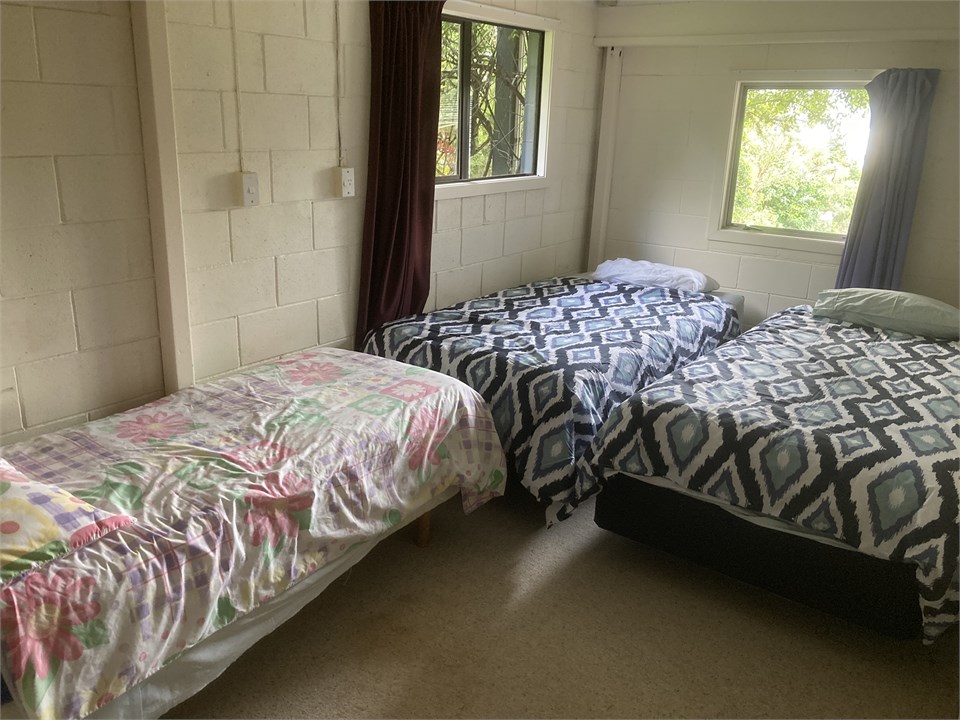 Downstairs 5th bedroom (2 King Singles, 1 single)