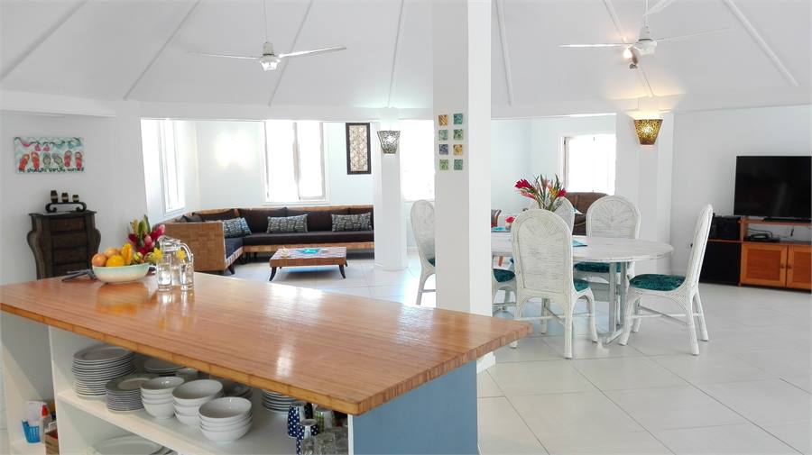 Open plan living area with large tv and stereo