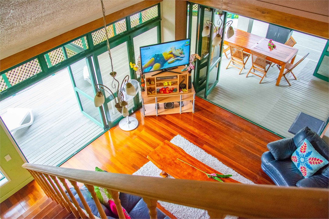 Spacious lounge area from stairway to rooftop deck