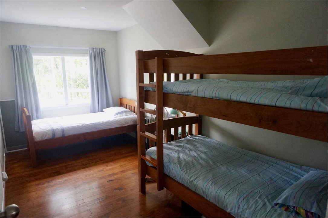 Downstairs bedroom with single bed and bunk bed