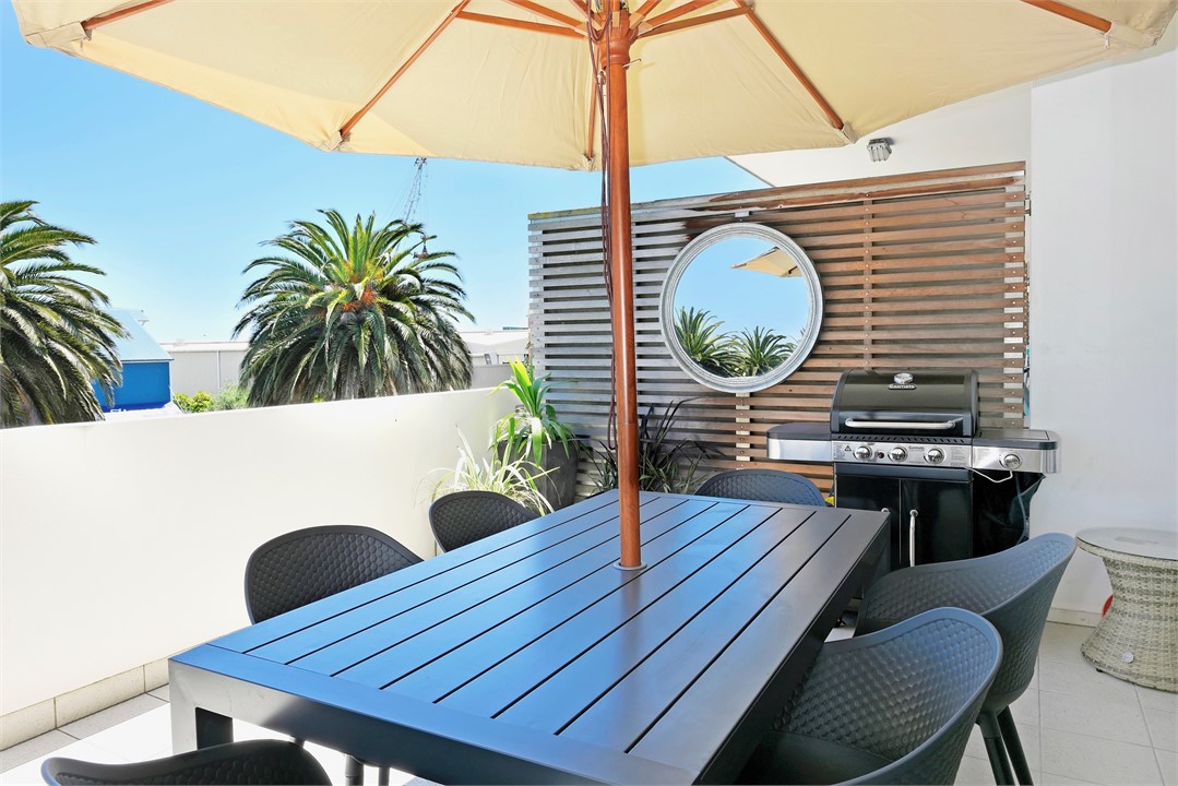 Outdoor dining area with BBQ