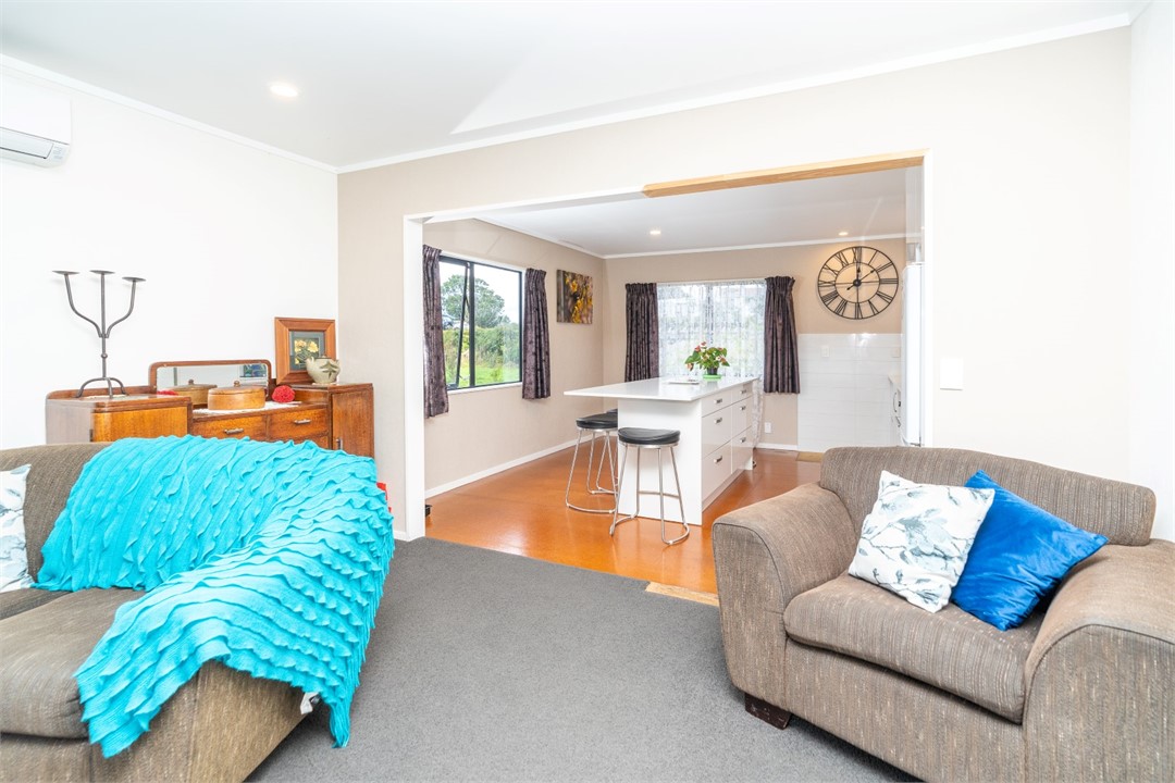 Living room with seating area and a TV