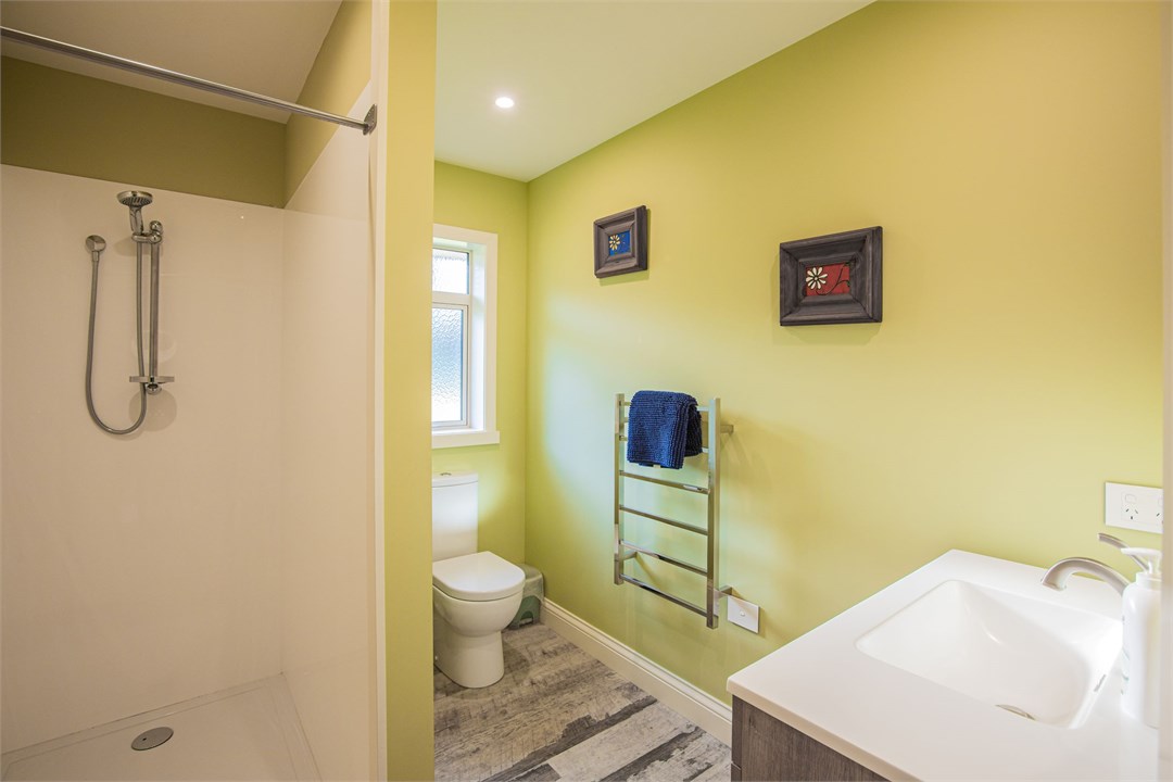 bathroom with toilet and shower