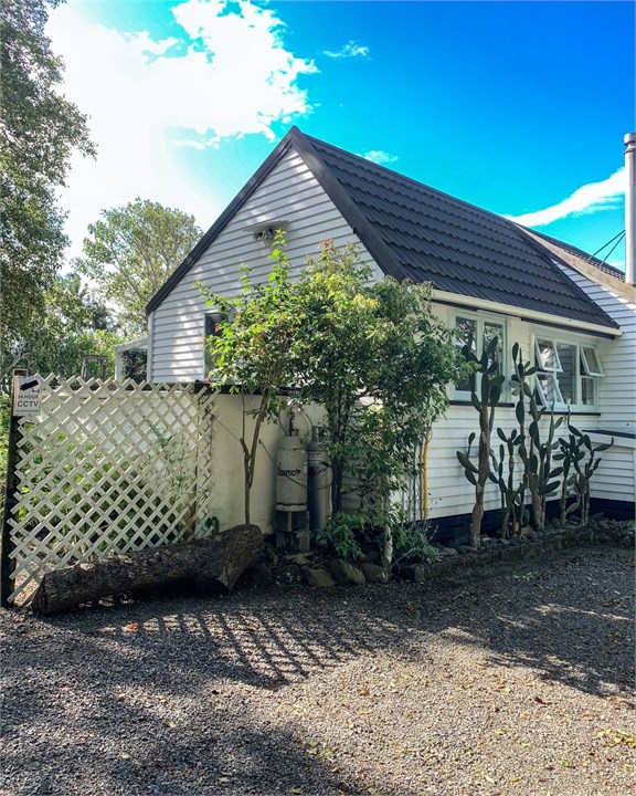 Entrance to the house is just to the left of this 