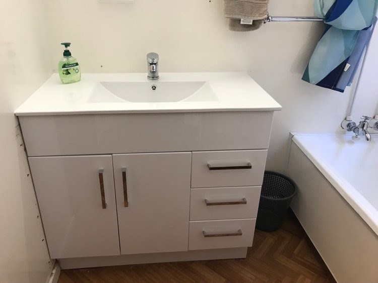 Bathroom with a bath, shower over it & another sep