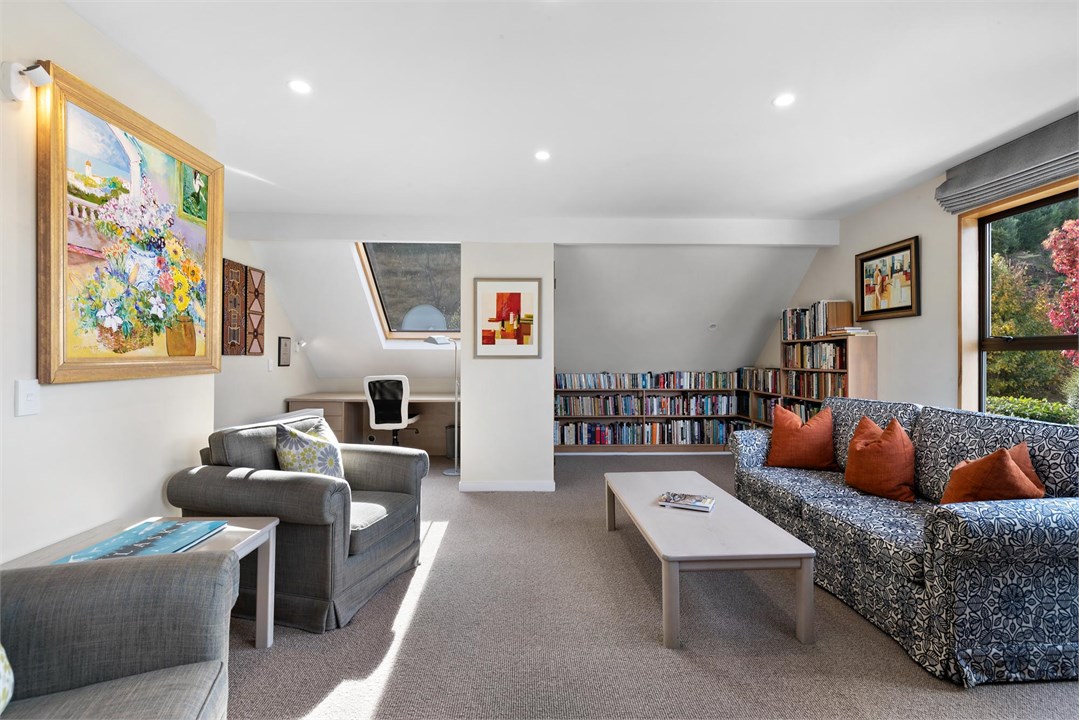 The mezzanine level with a desk and sofa bed